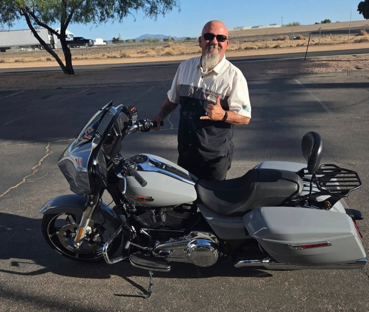 Original photo of a rider beside his touring motorcycle